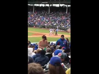 girl showing breasts in the stadium