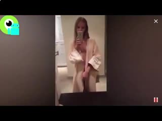 chick in front of the mirror shows her new thing cam